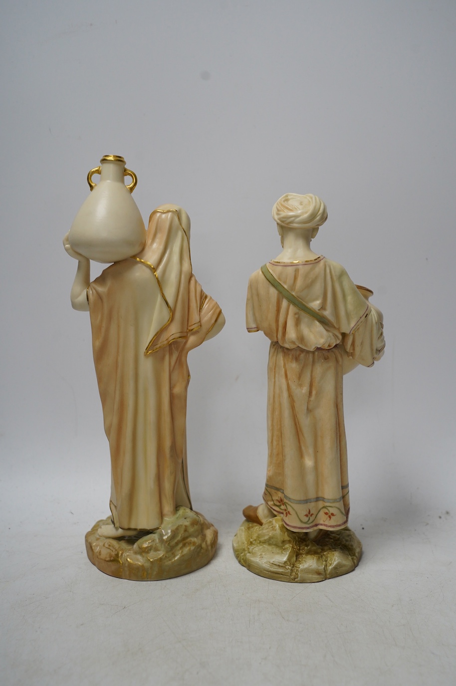 Two Worcester water carrier figures, 1250, largest 25cm high. Condition - good